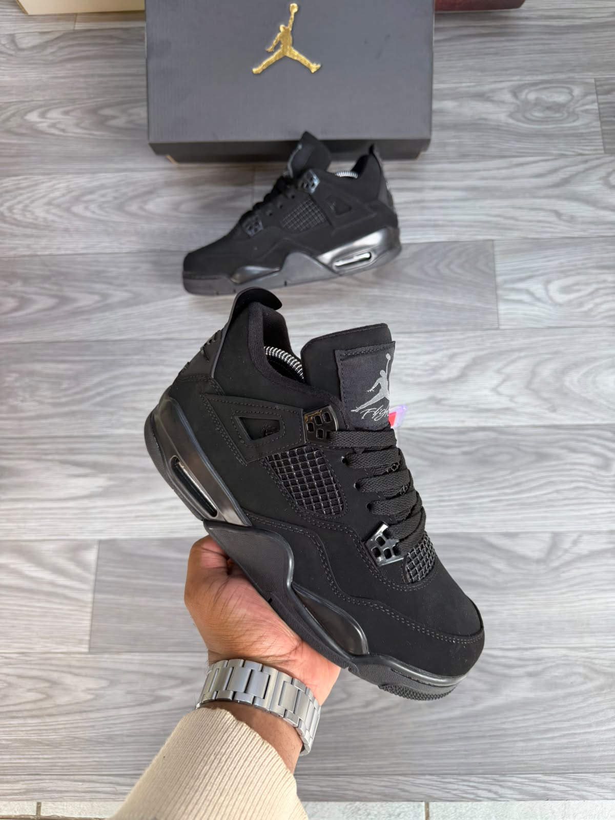 Black Jordan-style high-top sneaker